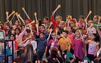 Children singing at faculty frolics